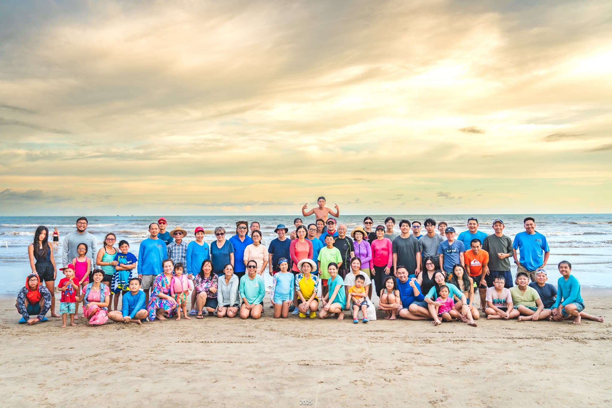 The whole scouting family gathered on the beach at sunset